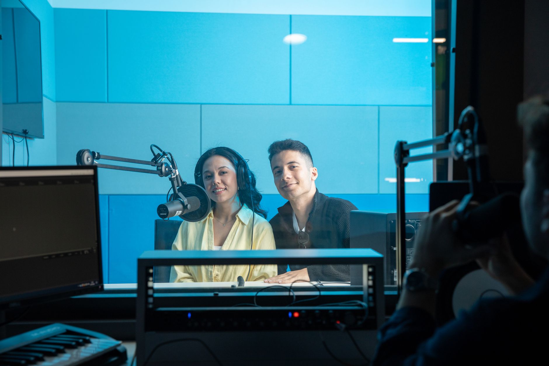 Journalists in radio and digital media production studio